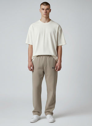 BeachBodyz® beige cotton blend joggers with elastic waistband and subtle logo embroidery.