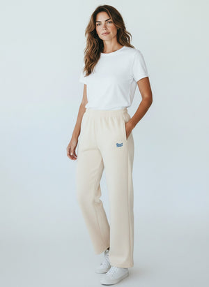 BeachBodyz® beige cotton blend joggers with embroidered logo and elastic waistband.