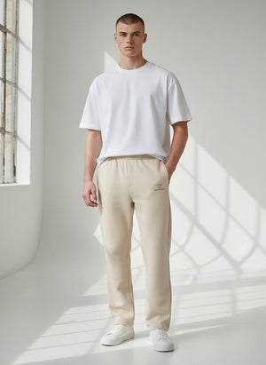 BeachBodyz® Original Hauszeichen beige cotton-blend jogging pants with subtle logo detail and elastic waistband.