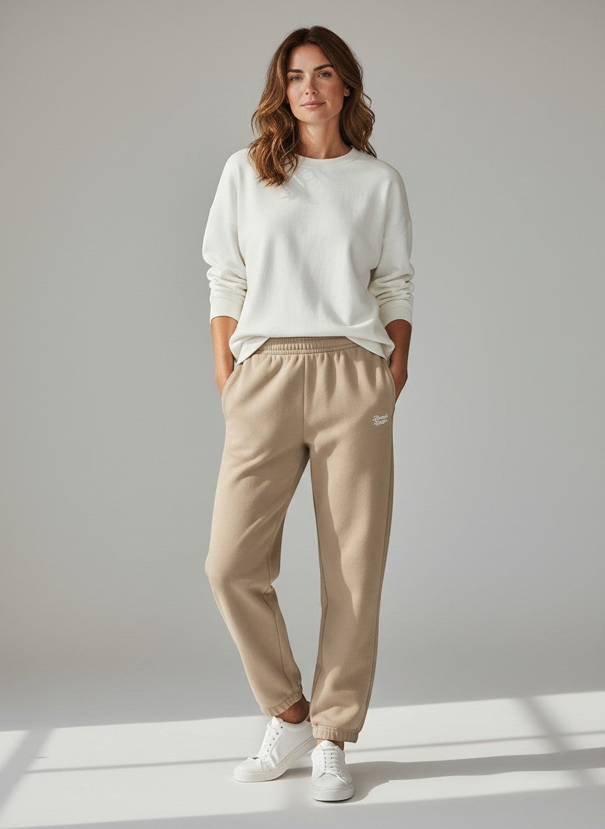 BeachBodyz® beige cotton blend jogginghose with embroidered logo and elastic waistband.