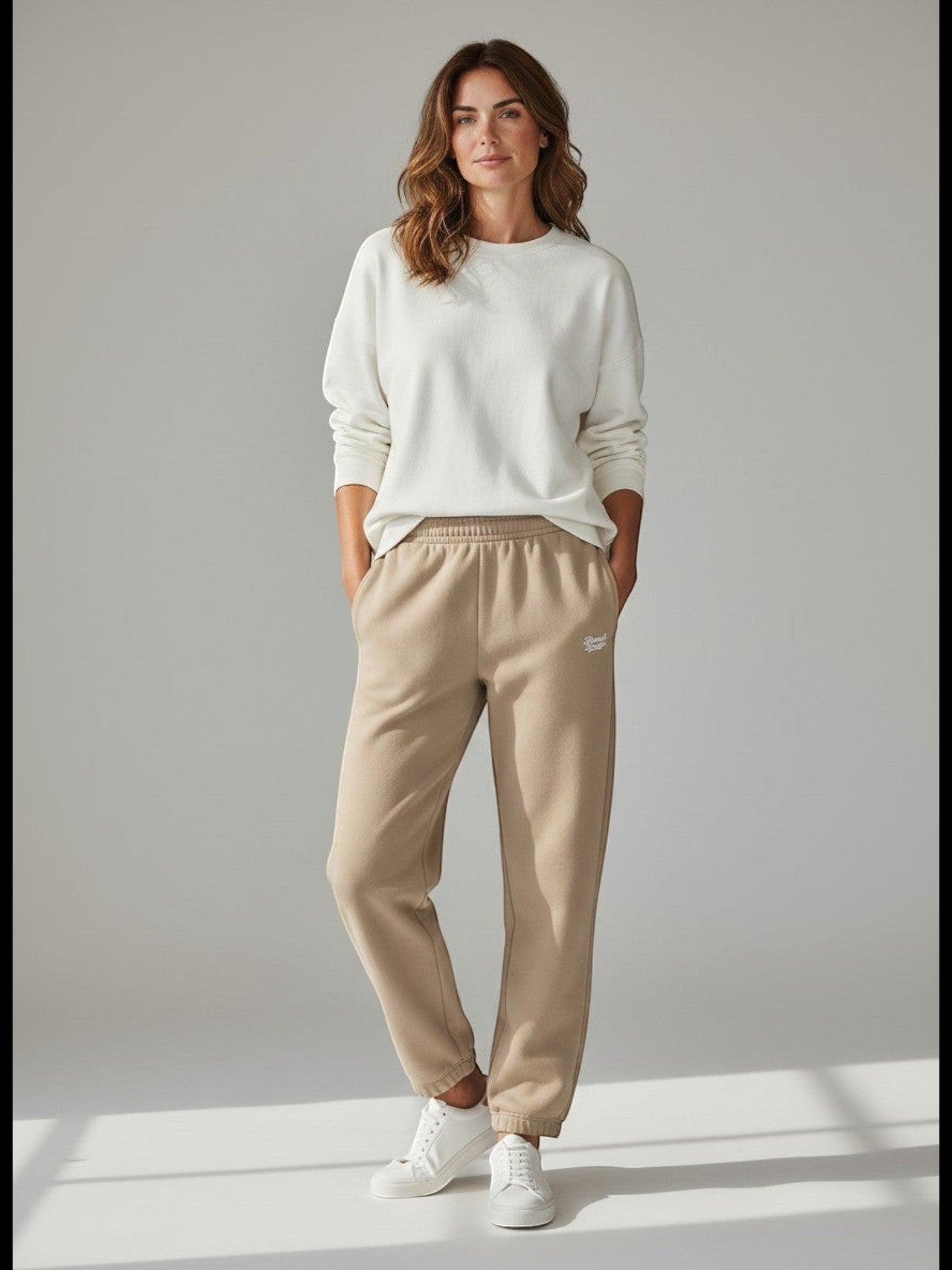 BeachBodyz® beige cotton blend jogginghose with embroidered logo and elastic waistband.