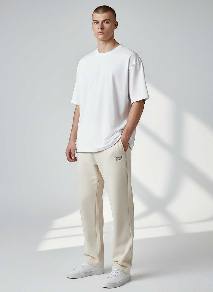BeachBodyz® beige cotton blend joggers with embroidered logo and elastic waistband.