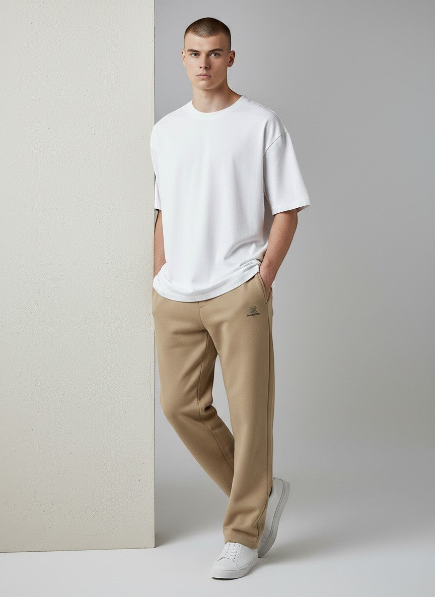 BeachBodyz® beige cotton blend standard fit jogging pants with elastic waistband and subtle logo.