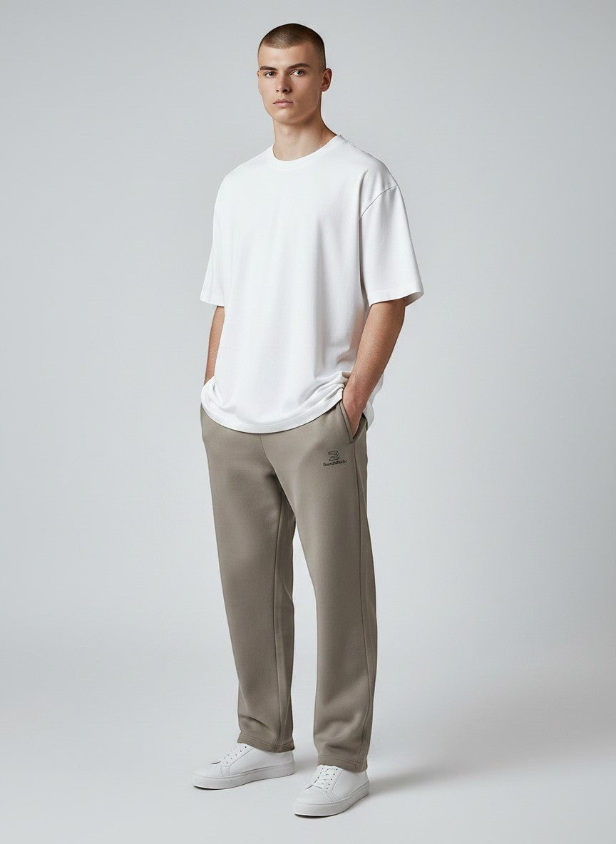 BeachBodyz® beige cotton blend jogging pants with elastic waistband and subtle logo.