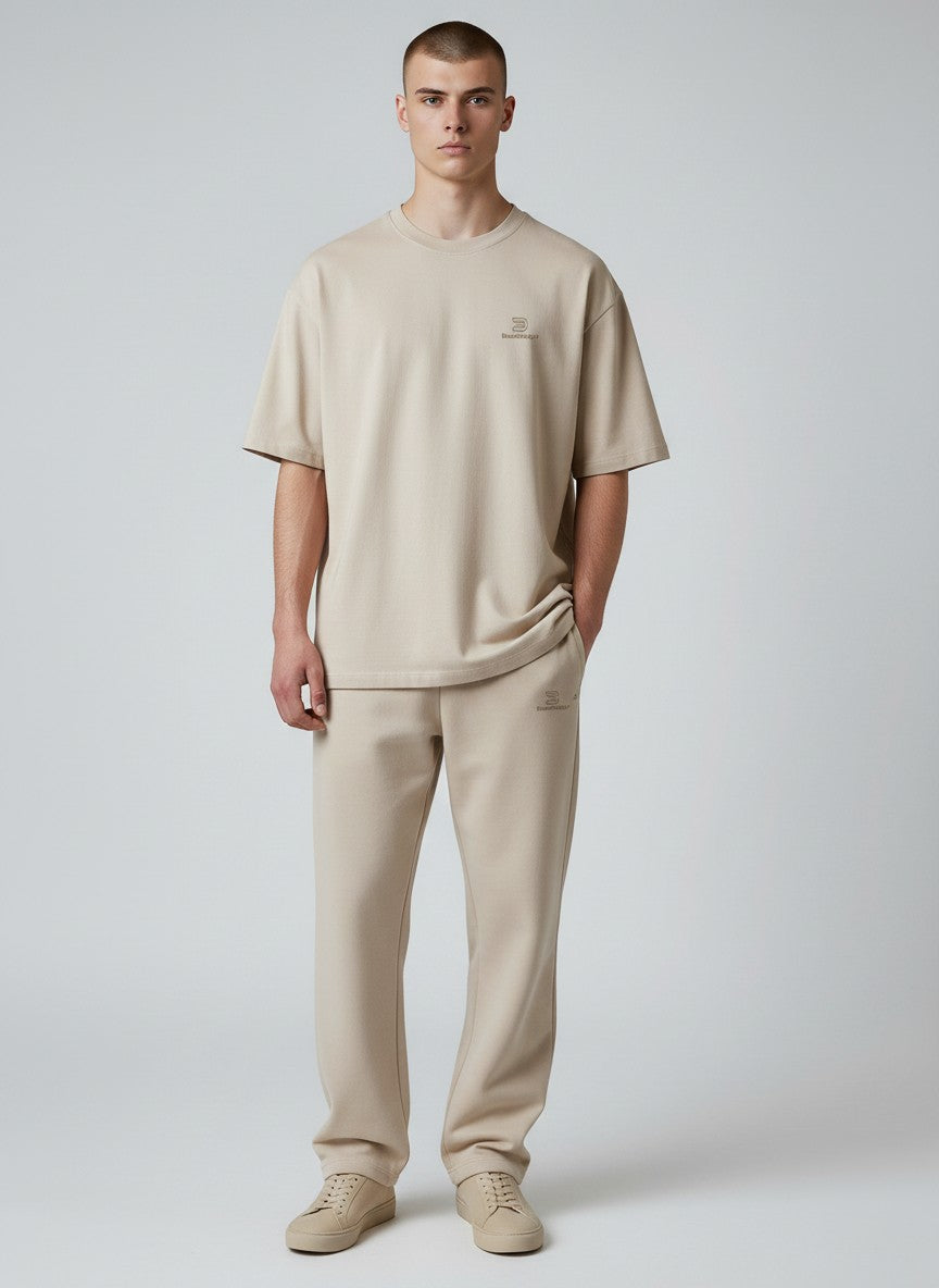 BeachBodyz® beige oversized fluffy cotton blend jogging pants with elastic waistband and subtle logo.