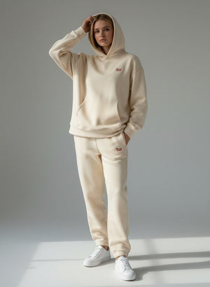 BeachBodyz® beige oversized fluffy cotton blend jogging pants with embroidered logo on left thigh.