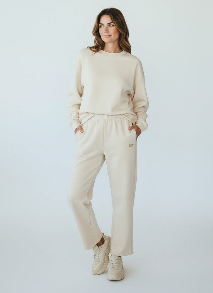 BeachBodyz® light beige cotton-polyester blend jogginghose with embroidered logo and elastic waistband.
