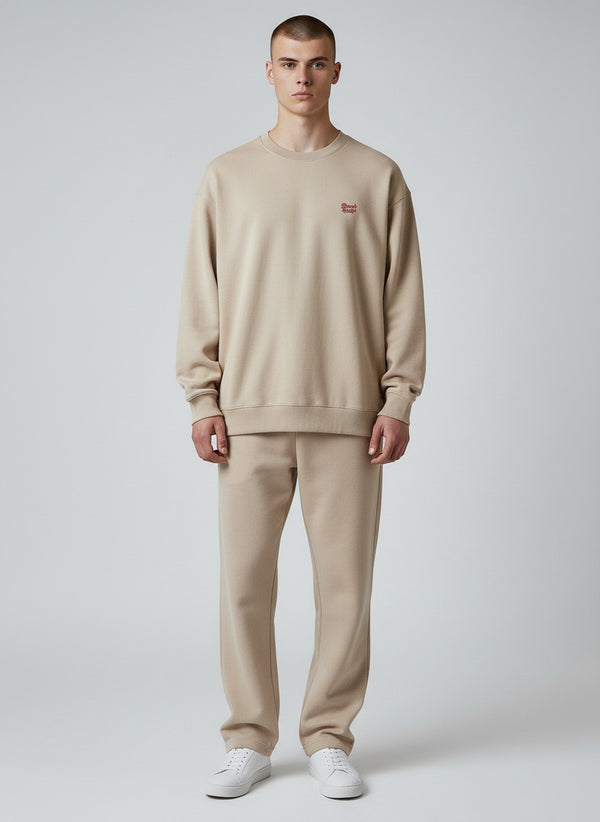 BeachBodyz® beige oversized sweatshirt made from organic cotton with a small red embroidered logo on the chest.
