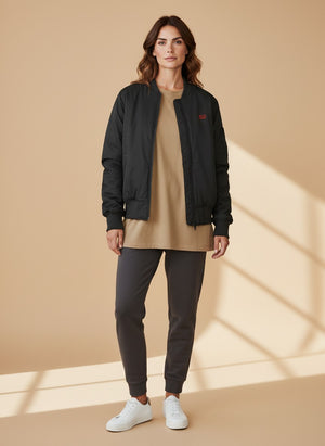 BeachBodyz® black bomber jacket with orange lining and embroidered logo. Classic streetwear style.