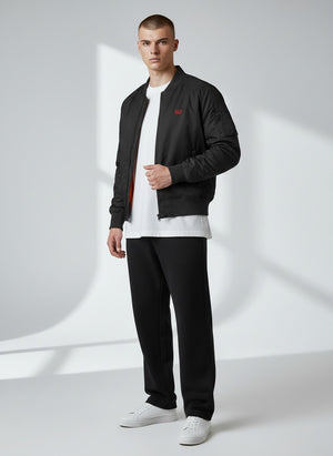 BeachBodyz® black bomber jacket with orange lining and embroidered logo. Features ribbed cuffs and hem.