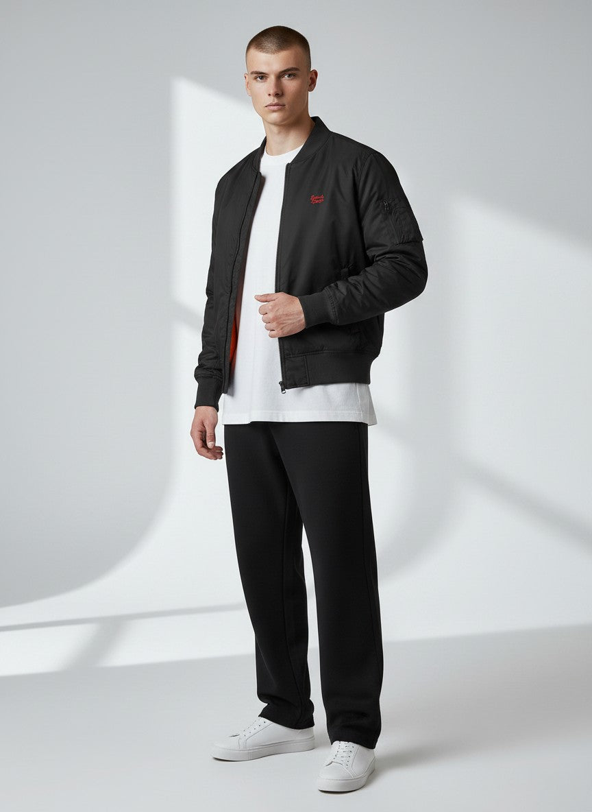 BeachBodyz® black bomber jacket with orange lining and embroidered logo. Features ribbed cuffs and hem.