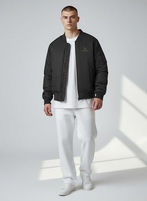 BeachBodyz® black bomber jacket for men and women with gold logo and zip pockets, ideal for streetwear.