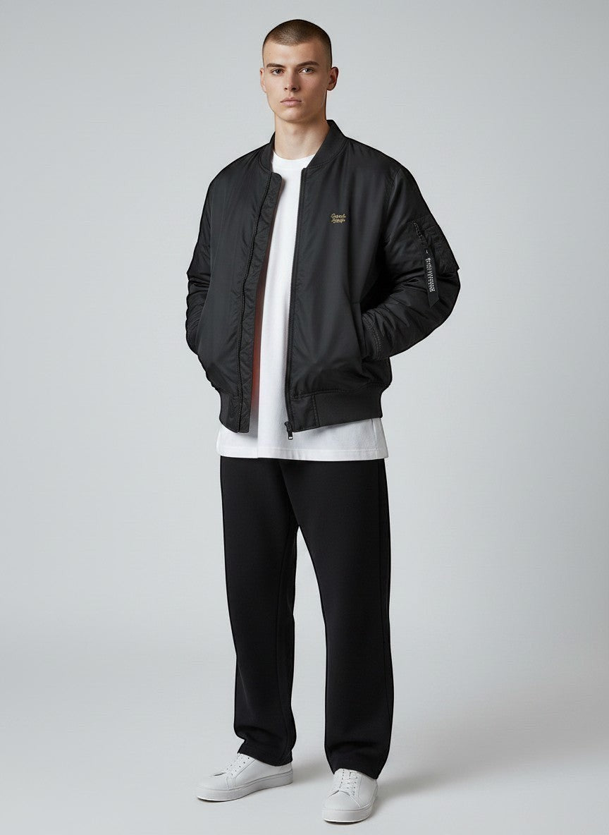 BeachBodyz® black bomber jacket with orange lining, classic collar, zip closure, and embroidered logo. Ideal for streetwear.