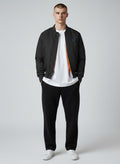BeachBodyz® black bomber jacket with orange lining and embroidered logo on chest. Ribbed cuffs and hem.