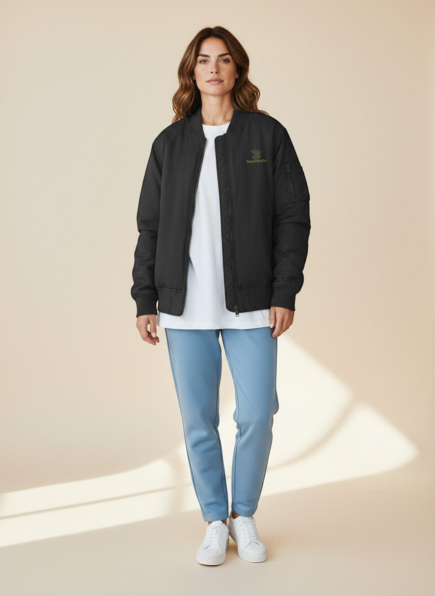 BeachBodyz® black bomber jacket for men and women with gold logo and zip pocket on sleeve.