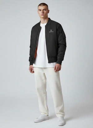 BeachBodyz® black bomber jacket with orange lining, zip closure, and embroidered logo. Suitable for streetwear.