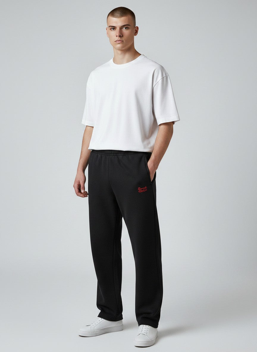 BeachBodyz® black cotton-blend jogging pants with red logo embroidery, elastic waistband, and side pockets.