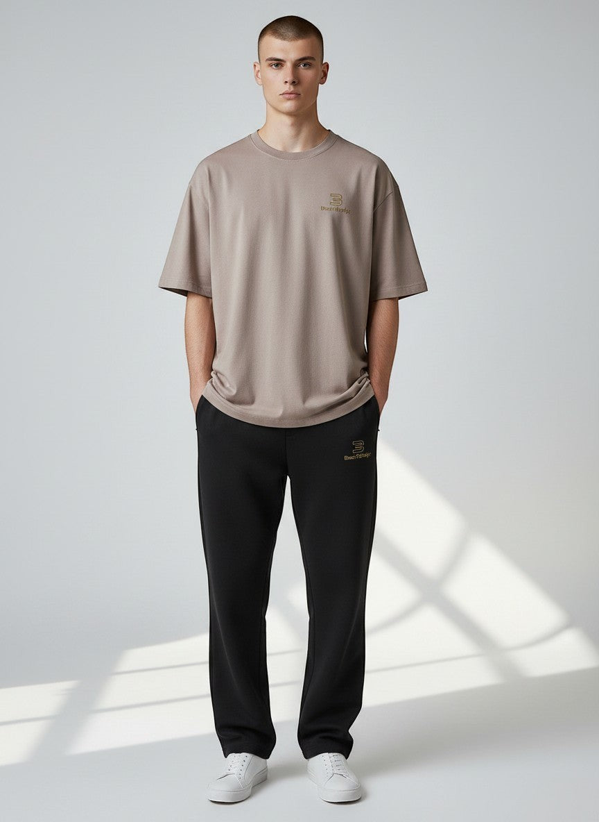 BeachBodyz® black cotton blend jogging pants with elastic waistband and subtle logo.