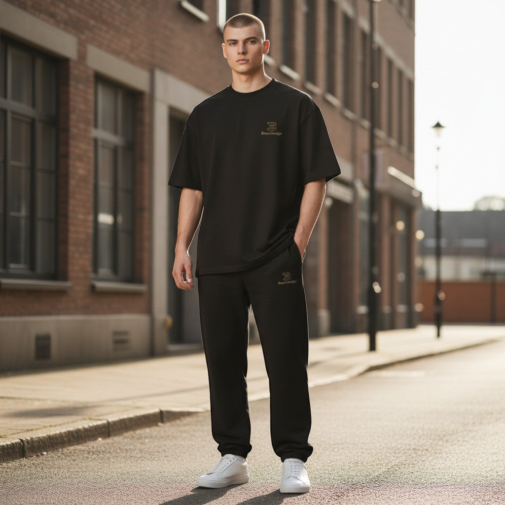 BeachBodyz® black cotton blend jogging pants with elastic waistband and subtle gold logo.