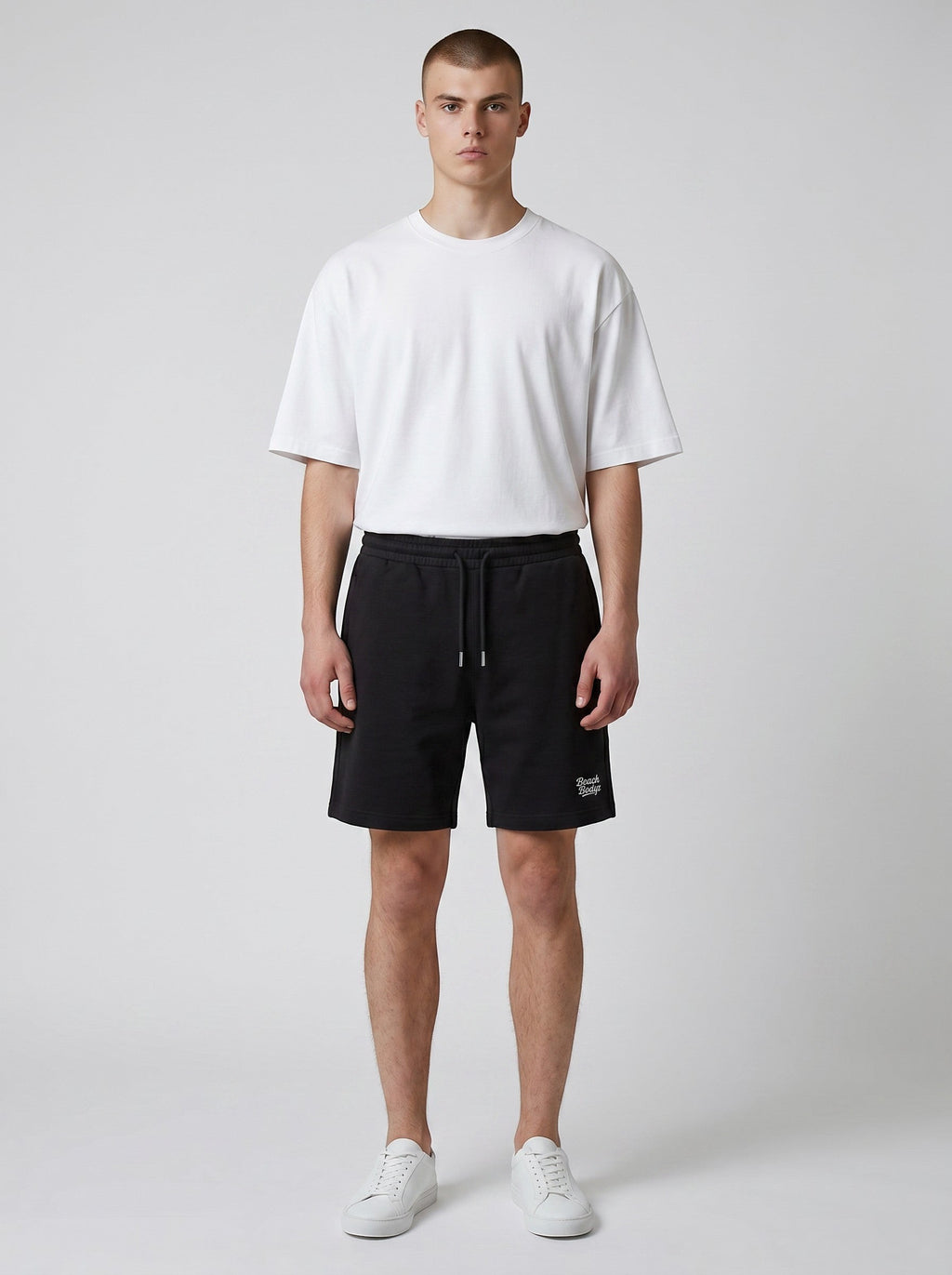 BeachBodyz® black cotton blend jogger shorts with white embroidered logo and drawstring waist.