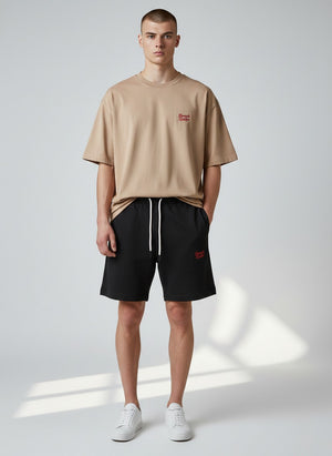 BeachBodyz® black organic cotton jogger shorts with embroidered logo and drawstring waist. Ideal for streetwear and active wear.