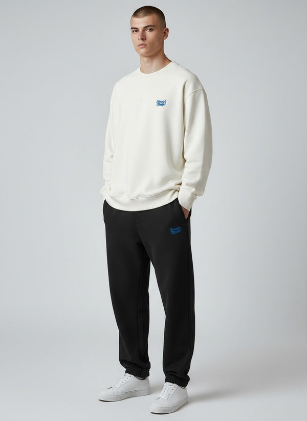 BeachBodyz® black fluffy cotton blend oversized jogging pants with blue logo detail and elastic waistband.