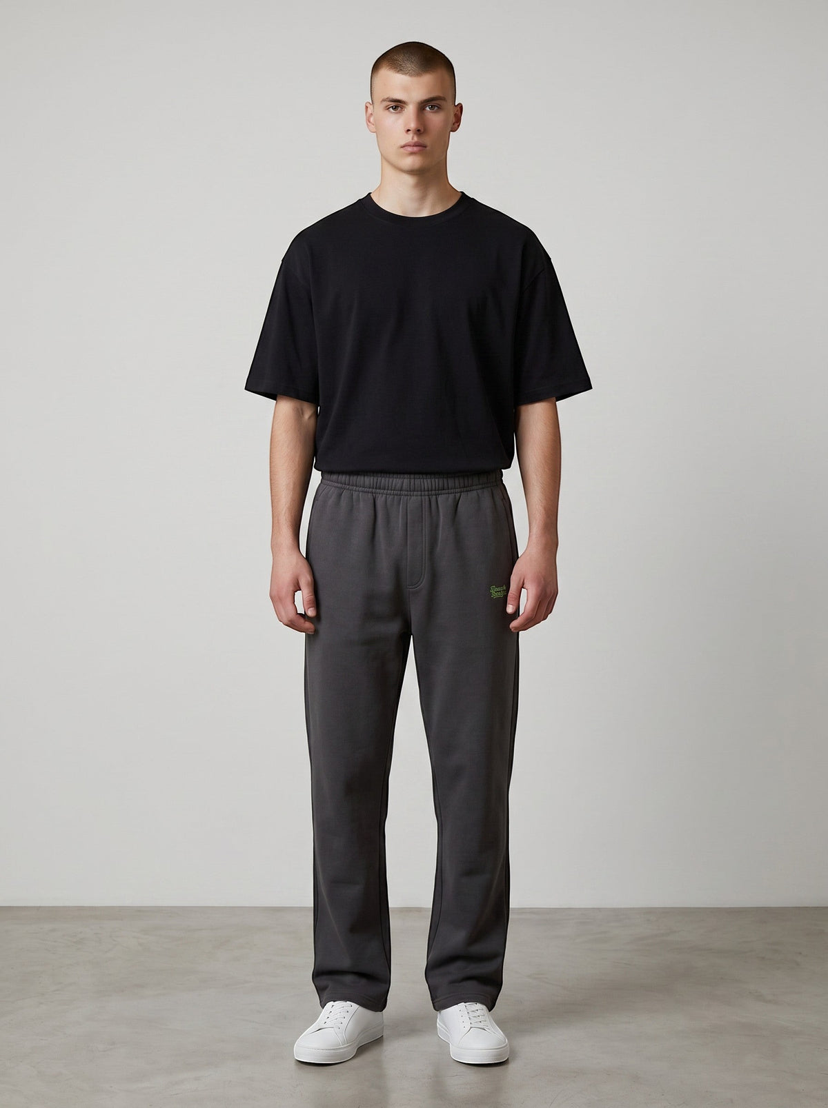 BeachBodyz® black cotton-polyester blend streetwear jogging pants with elastic waistband and logo.