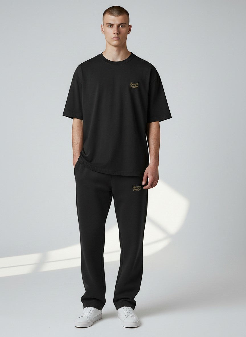 BeachBodyz® black cotton blend jogging pants with elastic waistband and embroidered logo.