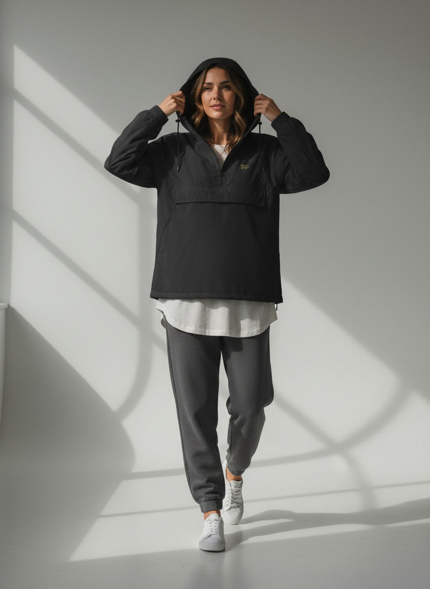 BeachBodyz® black lightweight windbreaker jacket with hood and quarter zip, featuring a chest logo and a large front pocket.