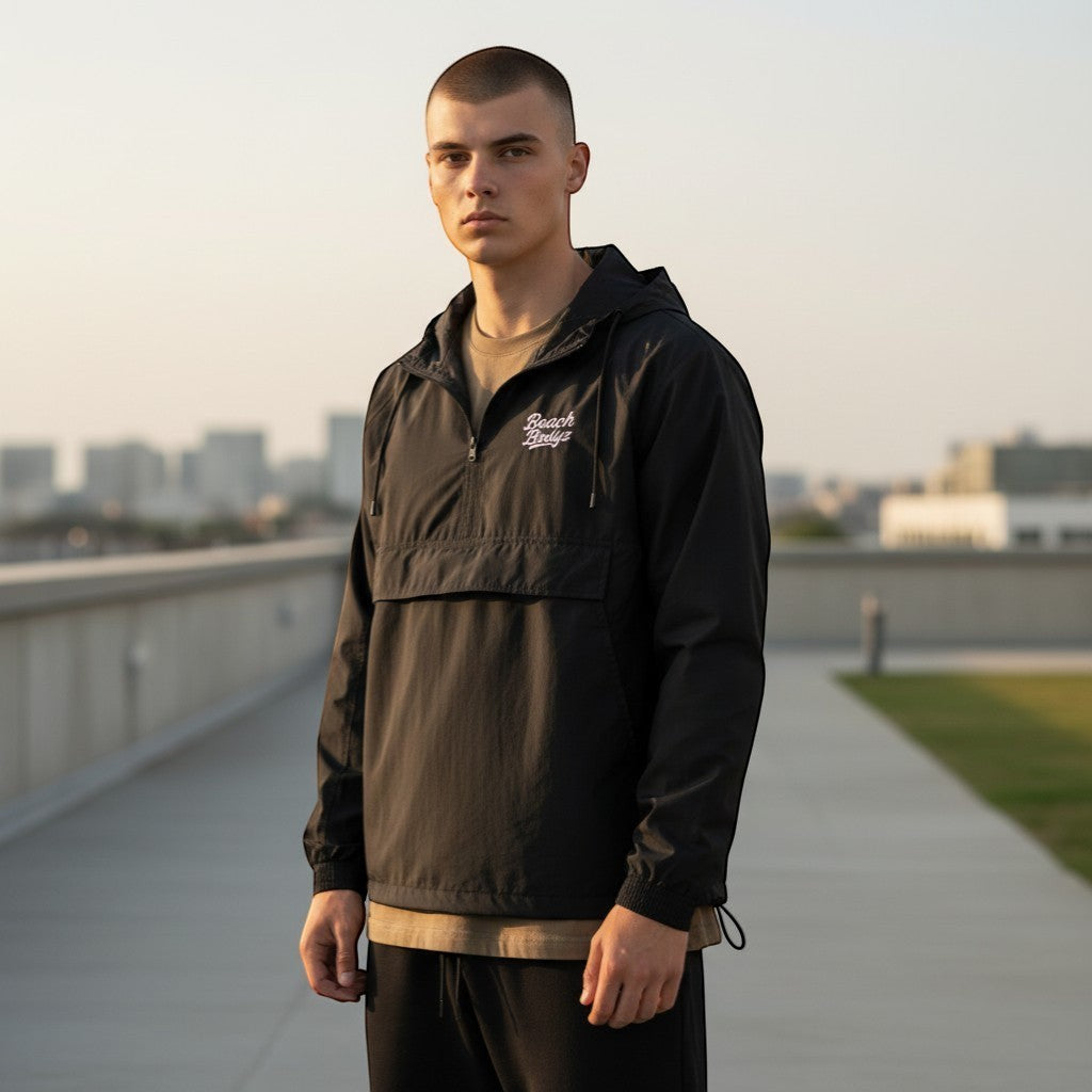 BeachBodyz black lightweight windbreaker jacket with hood and front pouch pocket. Wind and water-resistant.