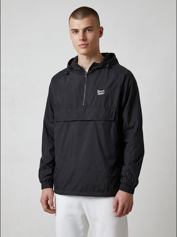 BeachBodyz® black lightweight windbreaker jacket with hood and quarter zip, featuring a chest logo and kangaroo pocket.