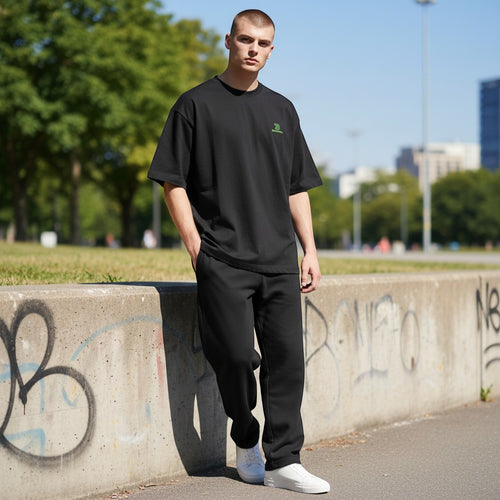 BeachBodyz® black oversized cotton t-shirt with green embroidered logo on chest. Short sleeves, crew neck.