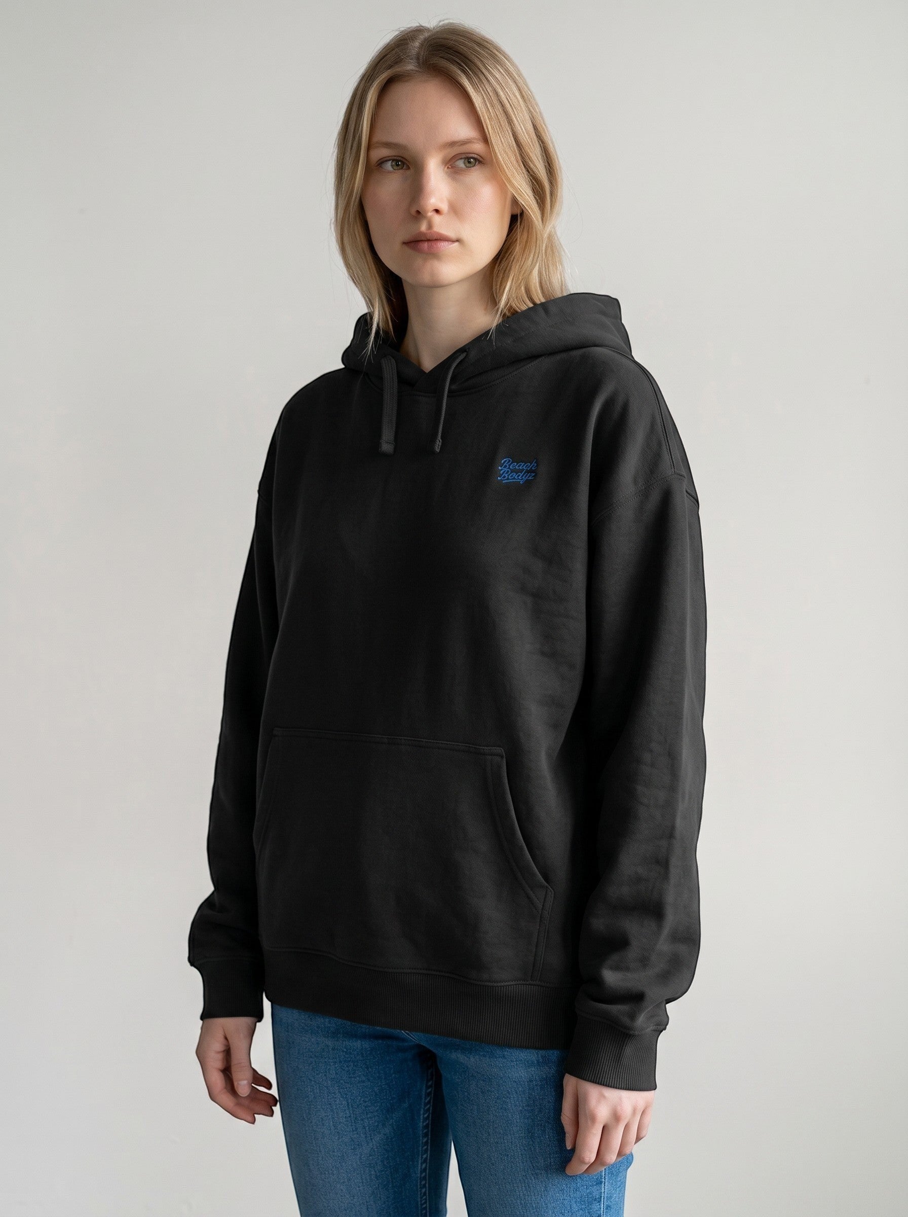 BeachBodyz® black oversized hoodie with blue embroidered logo on chest, made from organic cotton.