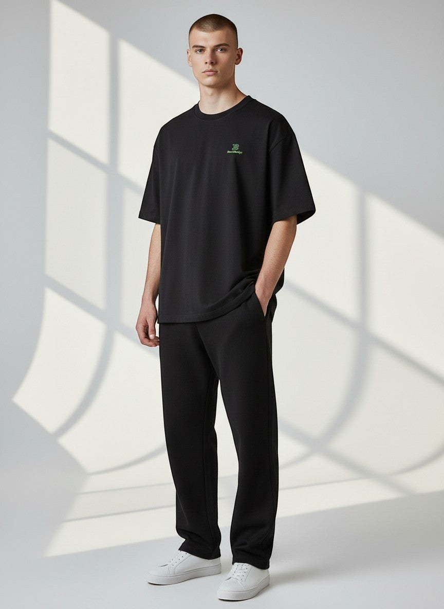 BeachBodyz® black oversized t-shirt made from 100% organic cotton with a small green embroidered logo on the chest.