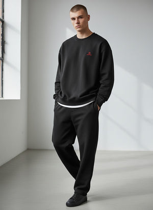 BeachBodyz® black oversized sweatshirt made from bio-cotton with a small red embroidered logo on the chest.