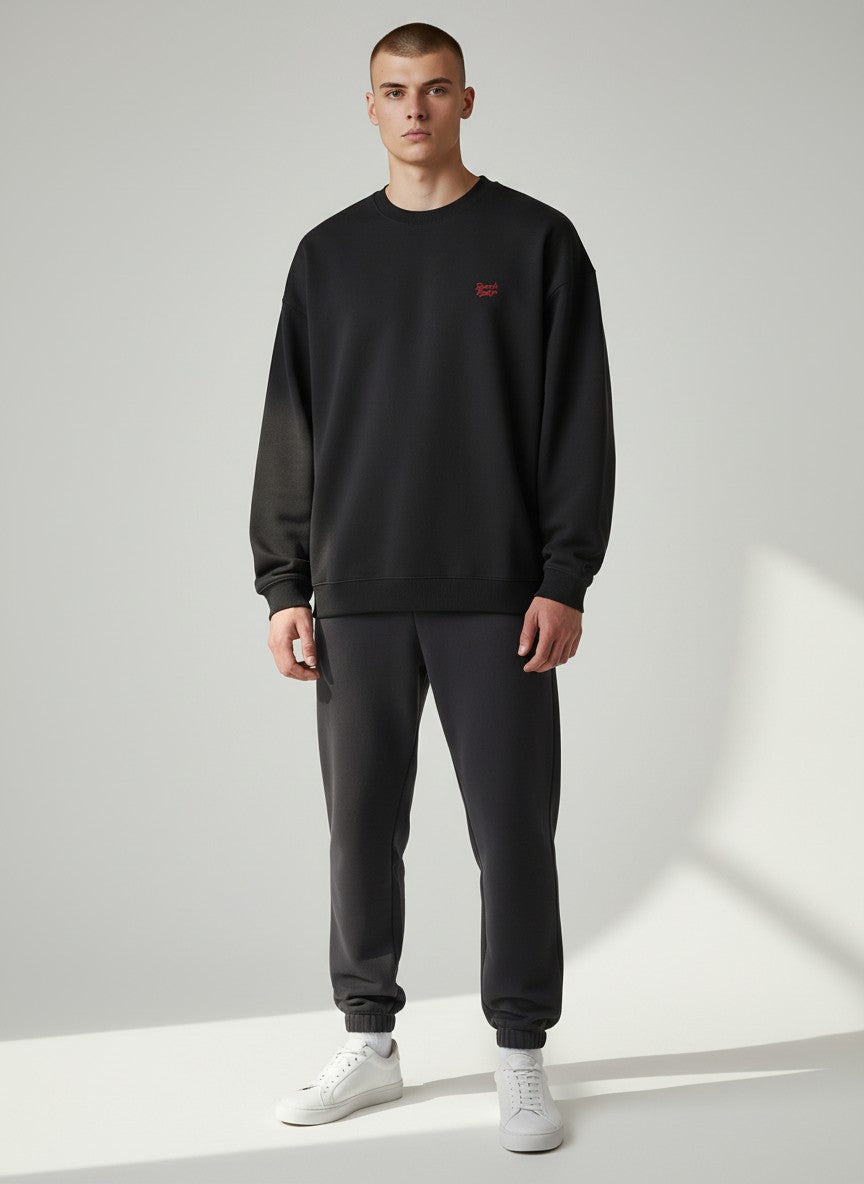 BeachBodyz® black oversized sweatshirt made from organic cotton with a small red embroidered logo on the chest.