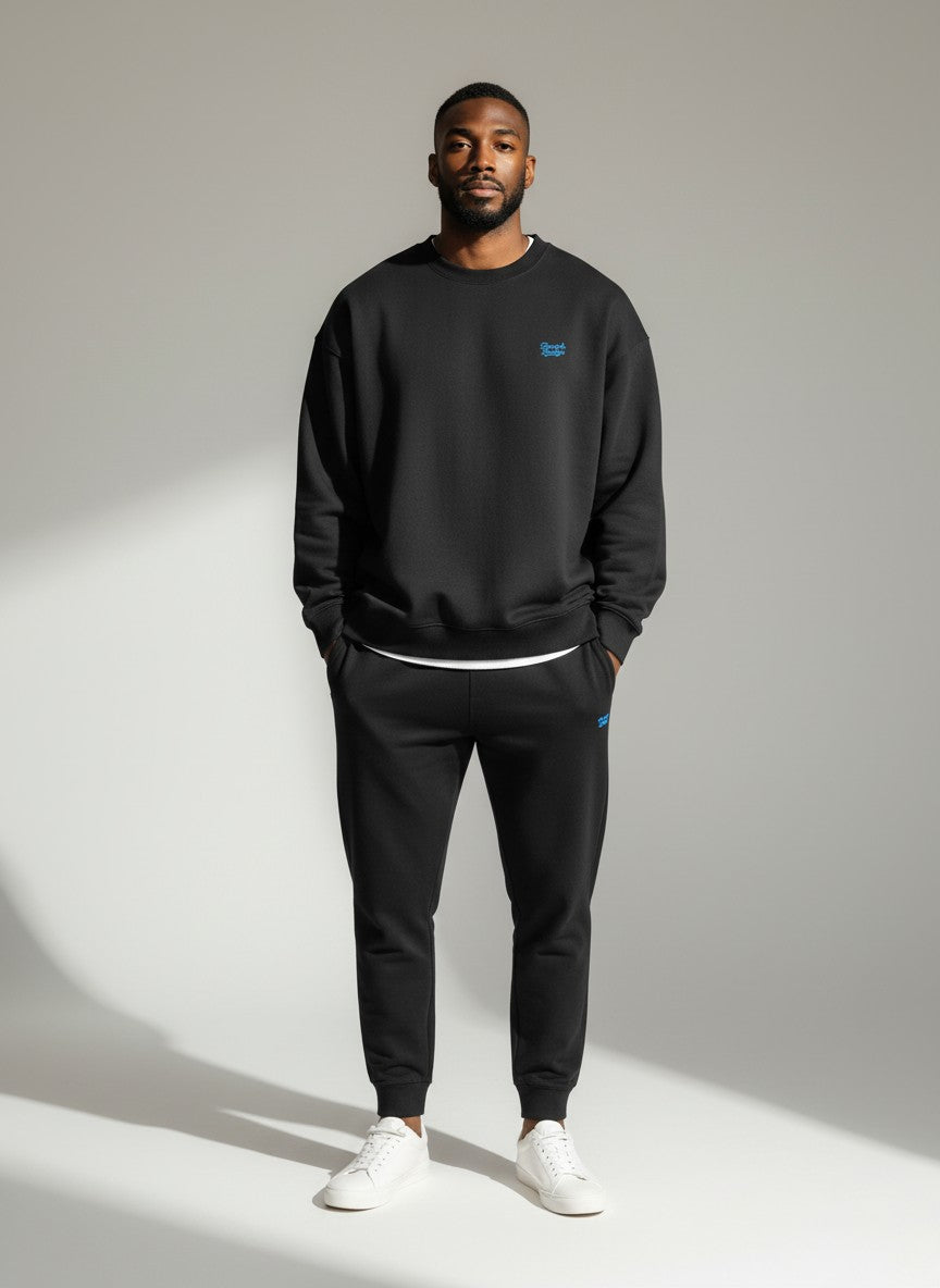BeachBodyz® black oversized sweatshirt made from organic cotton with a small blue embroidered logo on the chest.