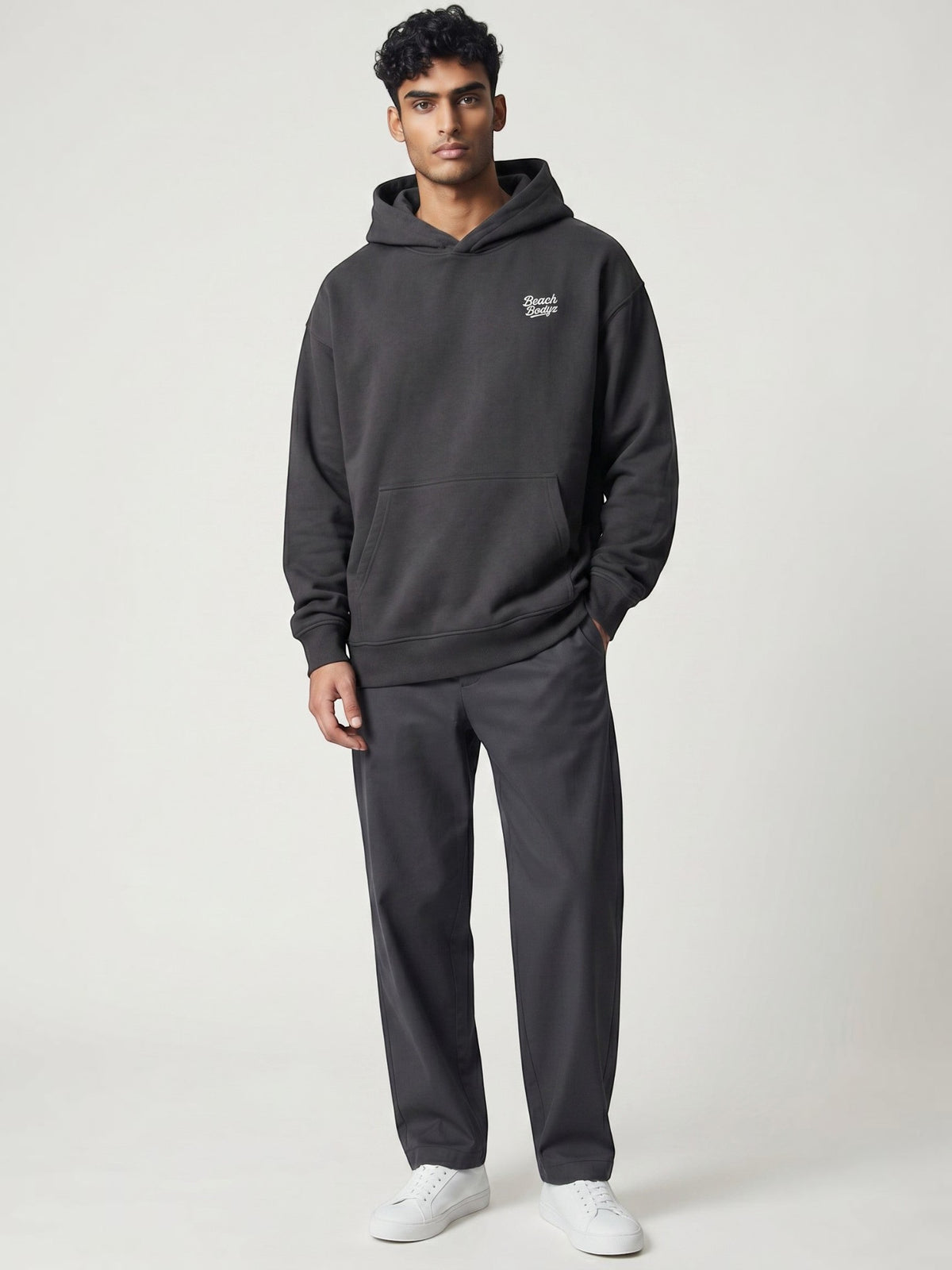 BeachBodyz® black oversized cotton hoodie with subtle chest embroidery and front pocket.