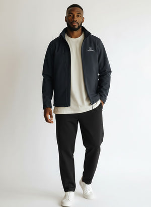 BeachBodyz® Identity softshell jacket for men and women in black, featuring a zip-up front, stand-up collar, and zippered pockets.
