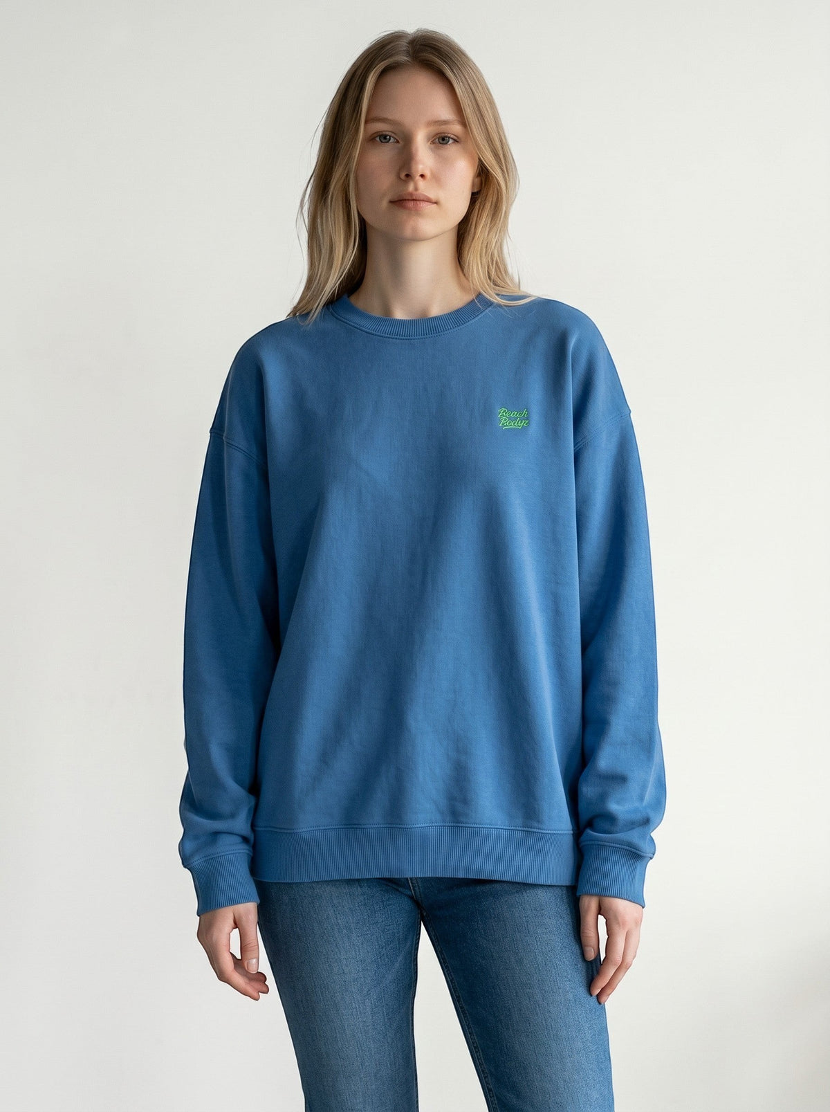BeachBodyz® blue organic cotton oversized sweatshirt with embroidered logo on chest. Crew neck, long sleeves, ribbed cuffs and hem.