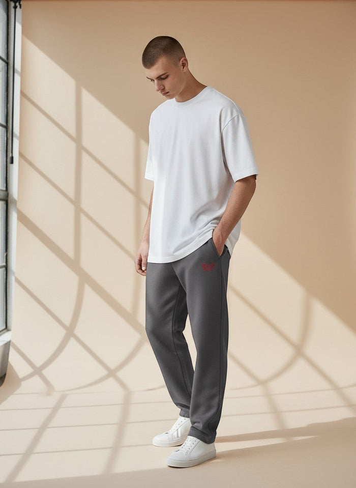 BeachBodyz® charcoal grey oversized fleece jogging pants with red logo embroidery and elasticated cuffs.