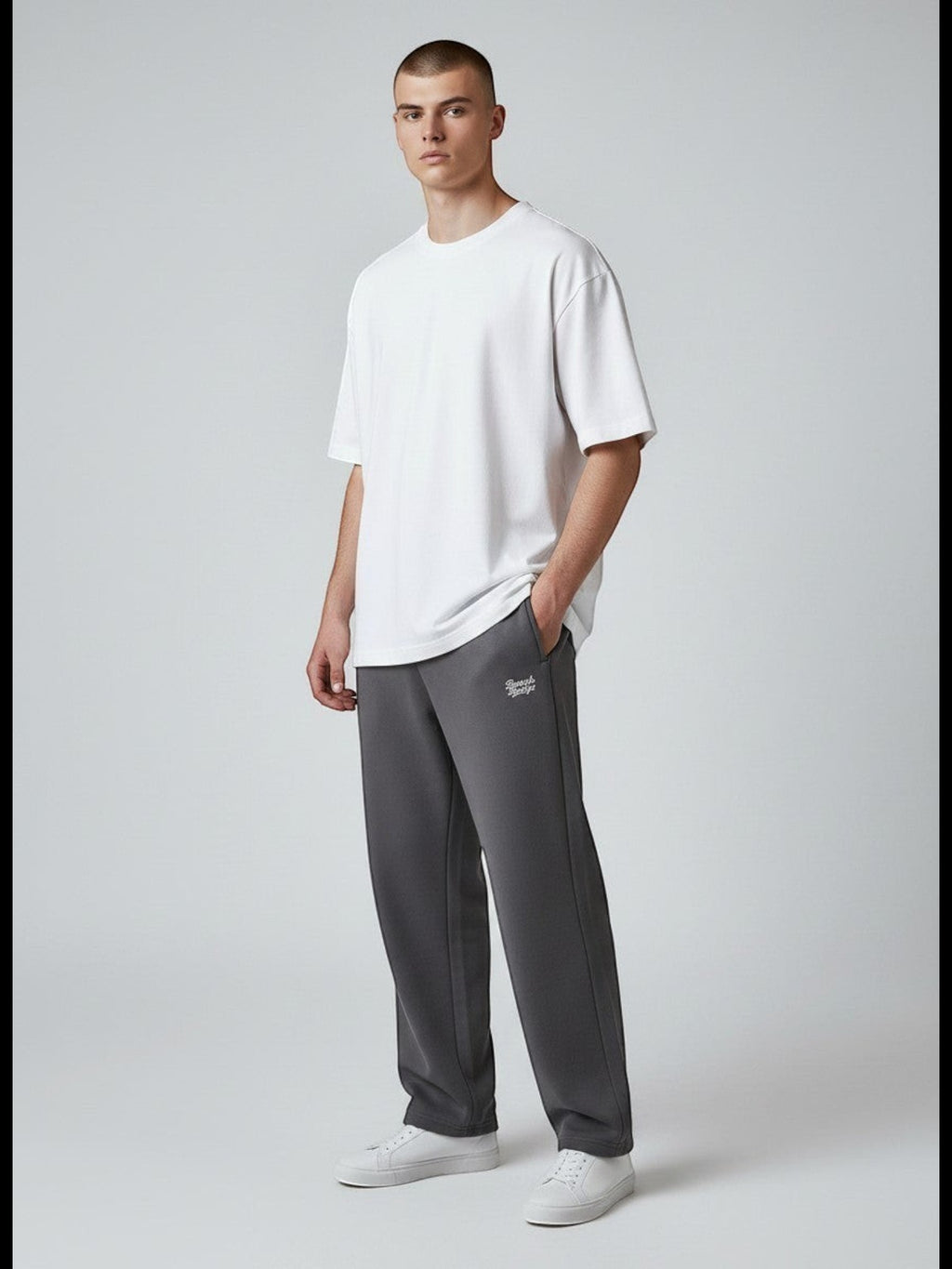 BeachBodyz® charcoal grey cotton blend jogging pants with elastic waistband and subtle logo embroidery.