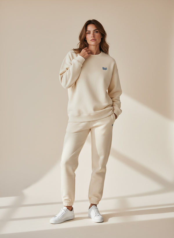 BeachBodyz® cream oversized sweatshirt made from organic cotton with blue embroidered logo on chest.
