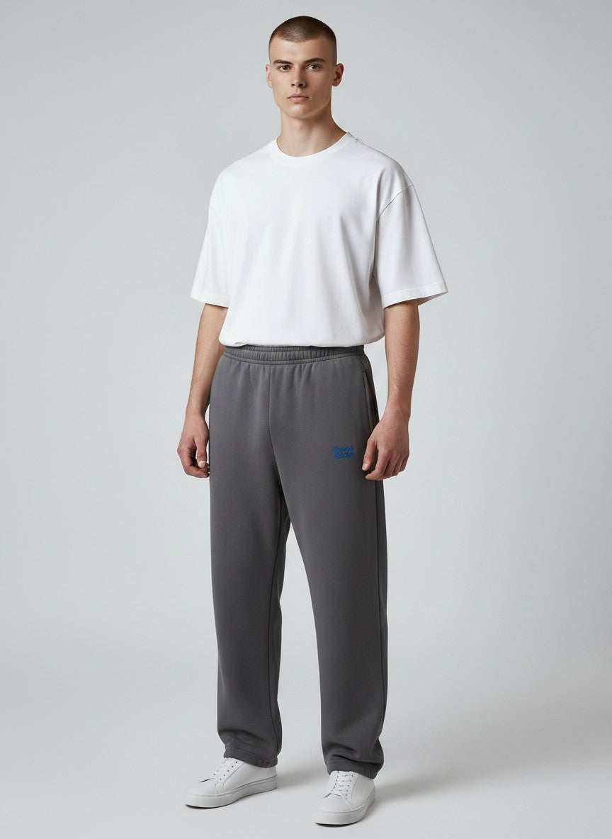 BeachBodyz® dark grey fluffy cotton blend oversized jogging pants with blue logo detail and elastic waistband.