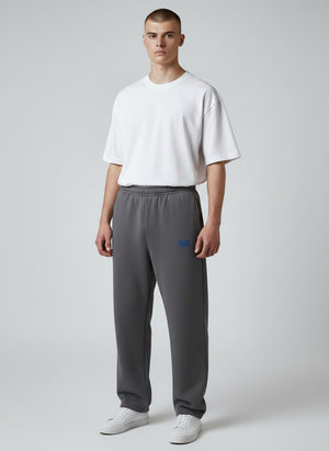 BeachBodyz® dark grey fluffy cotton blend oversized jogging pants with blue logo detail and elastic waistband.