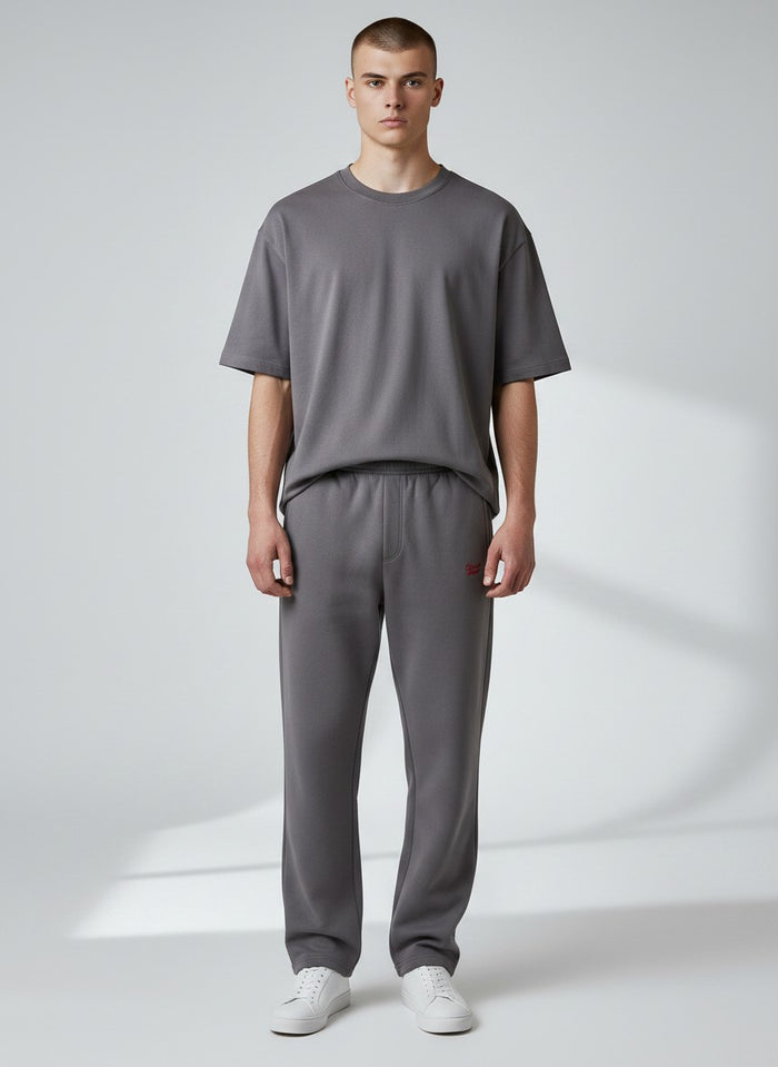 BeachBodyz® dark grey cotton-blend jogging pants with red logo embroidery and elastic waistband.