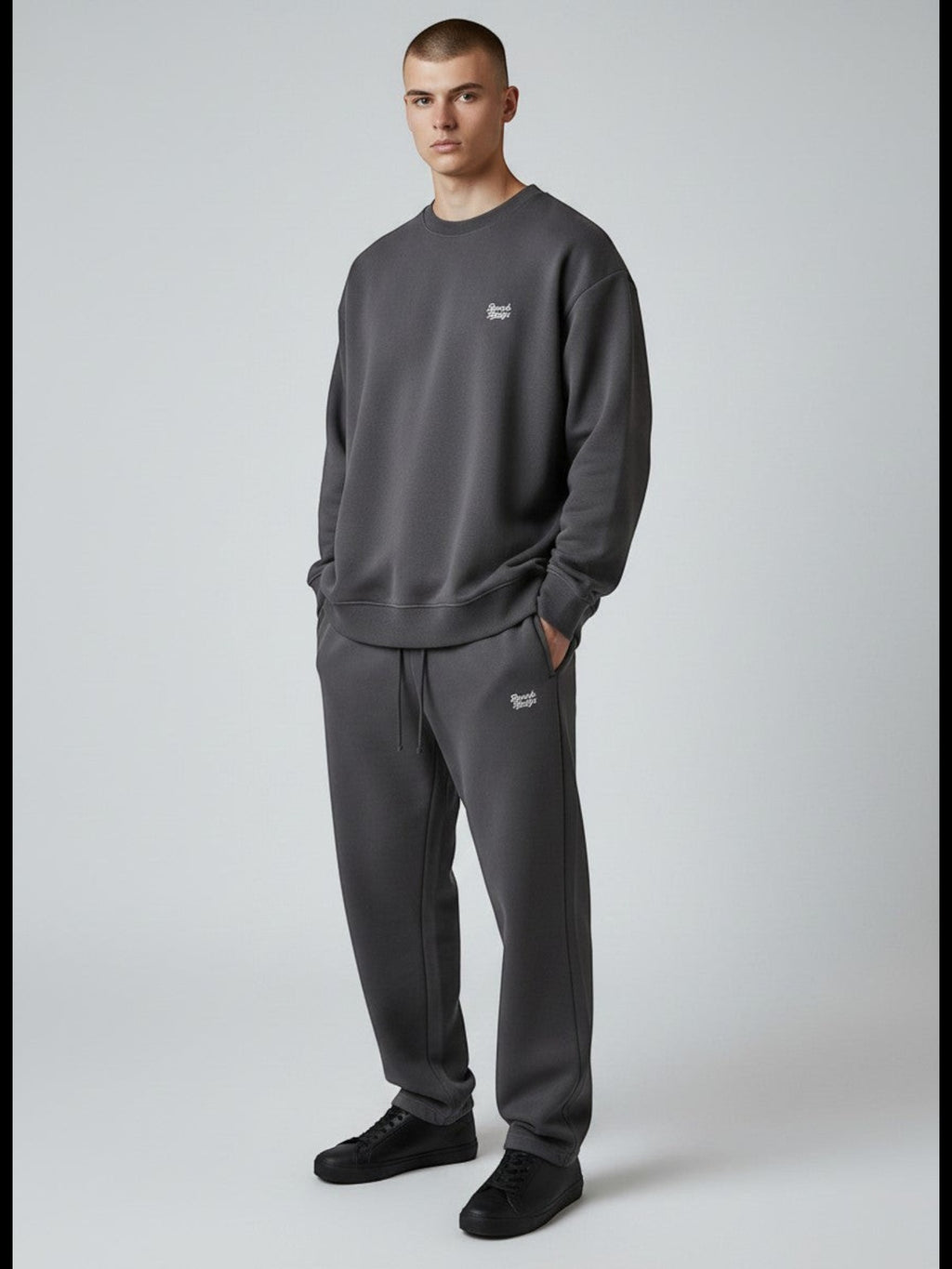 BeachBodyz® dark grey oversized cotton blend jogging pants with subtle logo embroidery. Comfortable streetwear style.