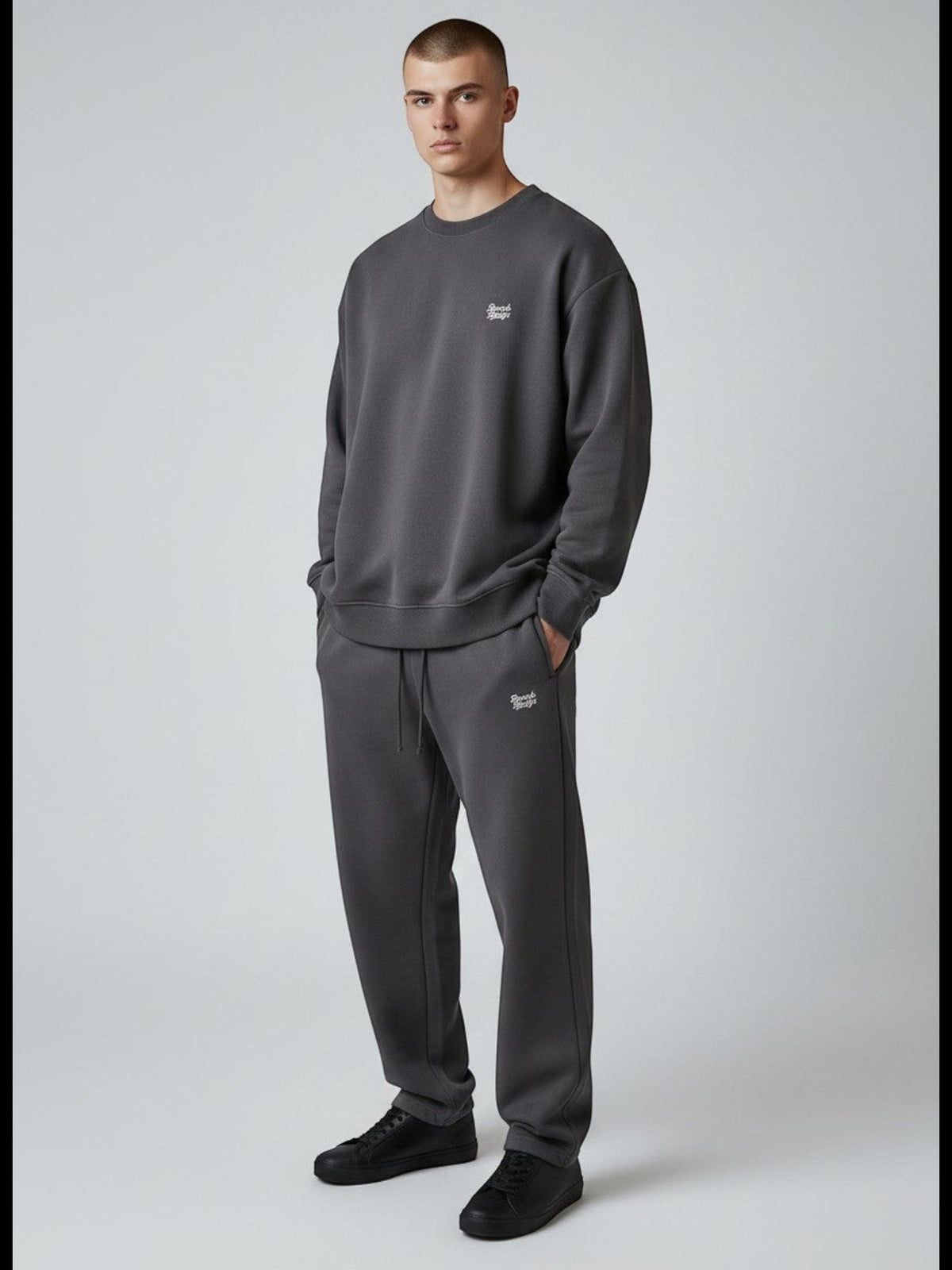 BeachBodyz® dark grey oversized cotton blend jogging pants with subtle logo embroidery. Comfortable streetwear style.