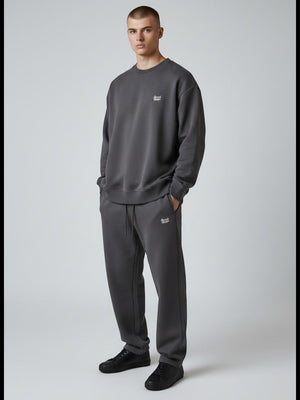 BeachBodyz® dark grey oversized cotton blend jogging pants with subtle logo embroidery. Comfortable streetwear style.