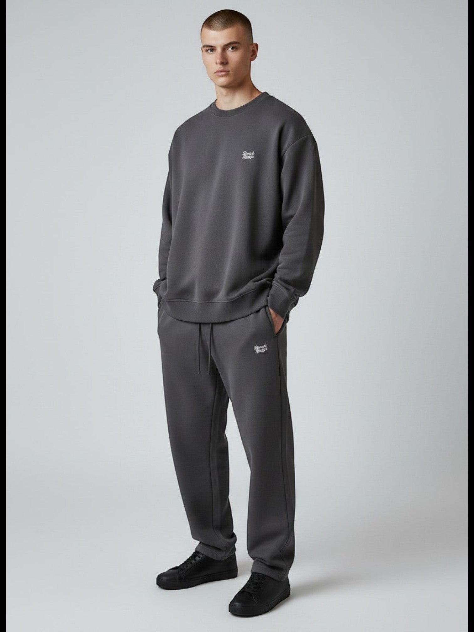 BeachBodyz® dark grey oversized cotton blend jogging pants with subtle logo embroidery. Comfortable streetwear style.